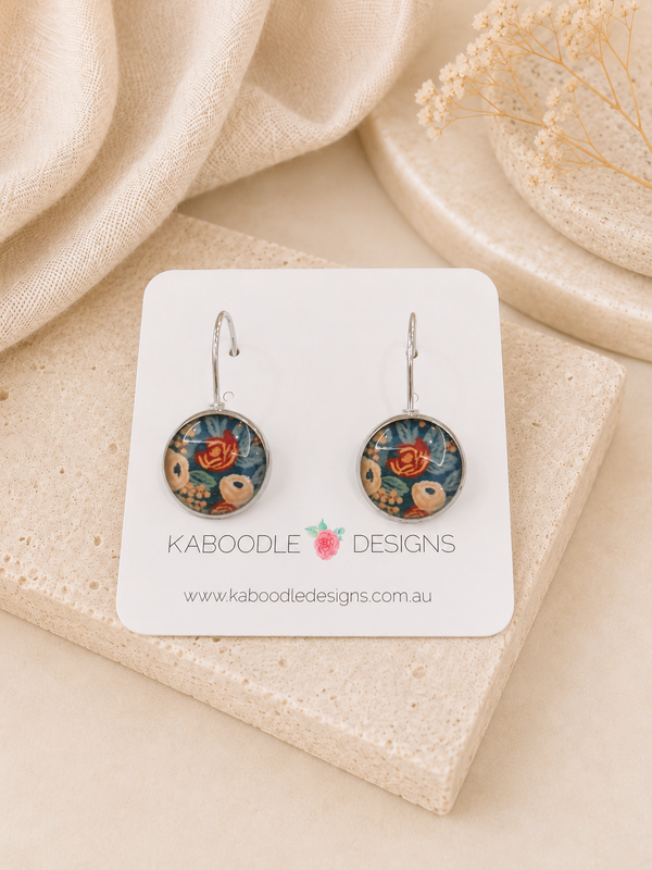 Round boho floral dome leverback earrings on Kaboodle Designs card, navy background with rust and blush flowers