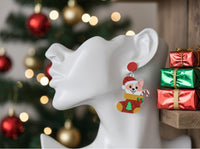 Corgi Christmas stocking earring shown on ear, red disc stud and dangle detail