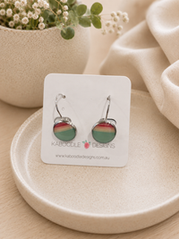 Round ombre dome earrings in coral, cream and teal on a Kaboodle Designs card with silver leverback hooks
