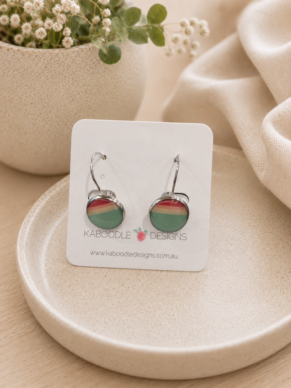 Round ombre dome earrings in coral, cream and teal on a Kaboodle Designs card with silver leverback hooks