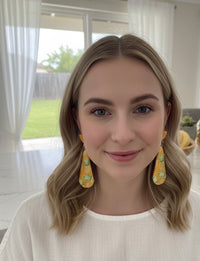 Pineapple teardrop earrings worn on model, shown front-facing for scale