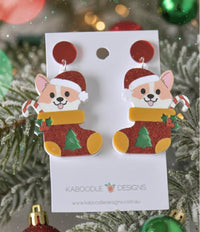 Acrylic corgi Christmas stocking earrings with red glitter finish and stud tops, on card