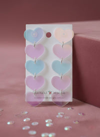 Translucent ombré heart drop earrings on white card, blue to pink gradient