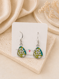 Teardrop earrings on display card with green, teal and white daisy print and stainless steel hooks