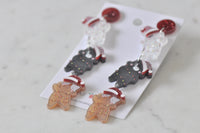 Christmas cat earrings laid on card showing glitter red stud and Kaboodle branding