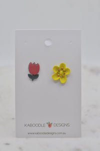 Red tulip stud and yellow flower stud earrings on a Kaboodle Designs backing card