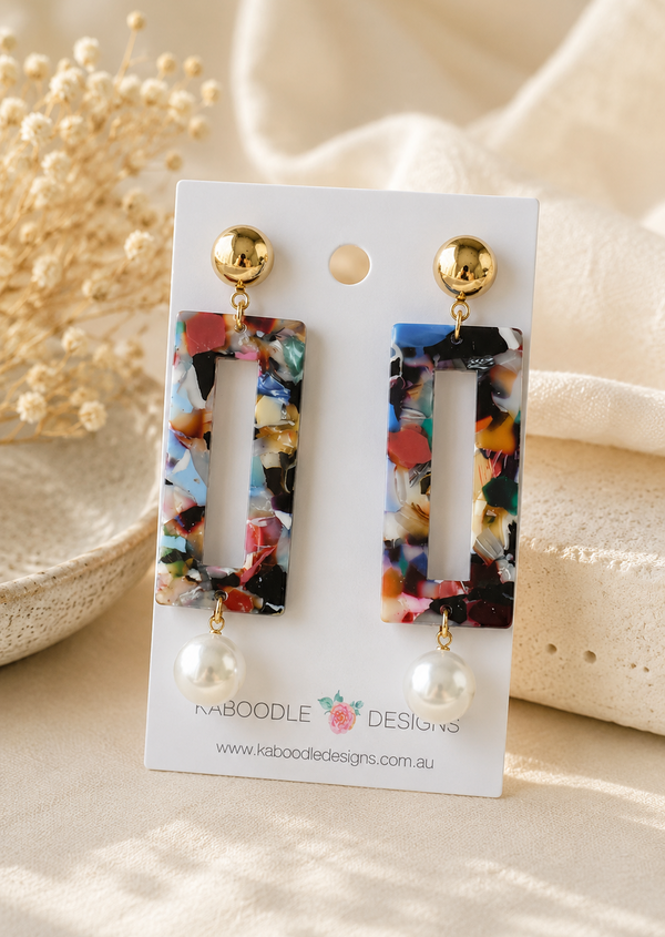 Multicoloured marbled acetate drop earrings with gold stud and faux pearl on card