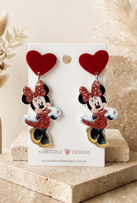 Red heart top earrings with glitter Minnie Mouse dangle charms displayed on a Kaboodle Designs card