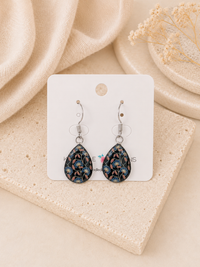 Teardrop dangle earrings on card with navy blue floral print and stainless steel hooks