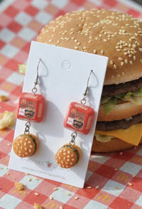 Red McDonald's-style burger box charm earrings paired with mini burger drops on a Kaboodle card