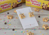 Hello Panda cookie earrings displayed on card with matching biscuit boxes and sprinkles