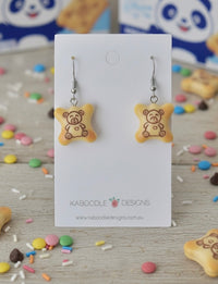 Resin Hello Panda cookie drop earrings on card, showing bear design and stainless steel hooks