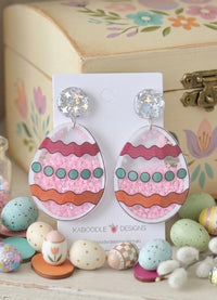 Acrylic Easter egg shaker earrings with pink glitter and striped design on Kaboodle card