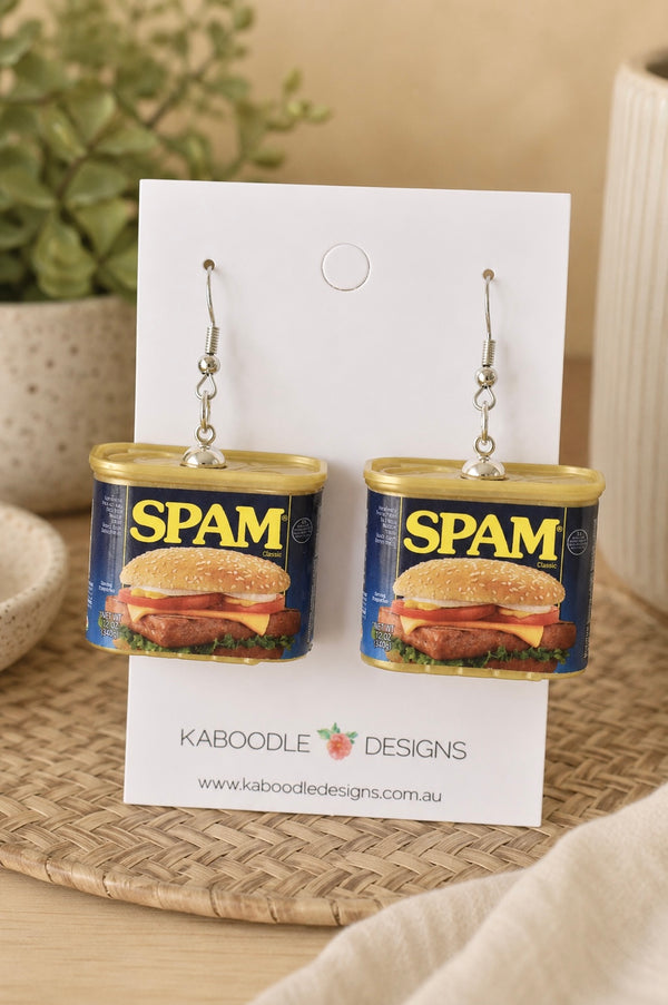 Pair of SPAM can novelty drop earrings on a Kaboodle Designs card, showing sandwich label detail