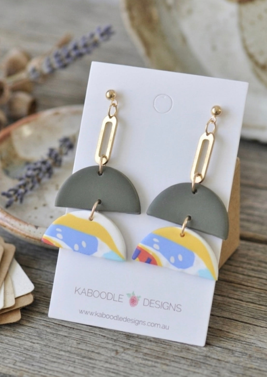 Sage green and abstract print clay drop earrings on Kaboodle Designs card with gold-tone chain link