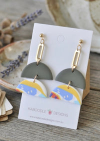 Sage green and abstract print clay drop earrings on Kaboodle Designs card with gold-tone chain link
