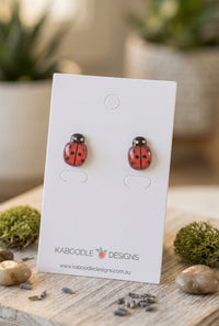 Red and black ladybird stud earrings on a Kaboodle Designs earring card