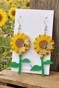 Acrylic sunflower and bee drop earrings on card with glitter flower centre and green leaf stem