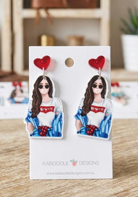 Acrylic statement earrings on card, red glitter heart top and illustrated fashionista girl in denim jacket