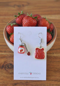 Resin drop earrings shown on card: strawberry jam jar with spoon, and jam toast slice