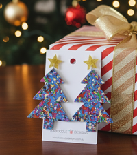 Multicoloured confetti acrylic Christmas tree earrings with gold glitter star studs on card backing