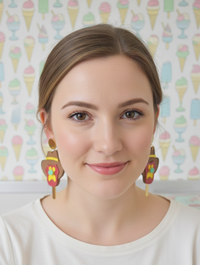 Model wearing Bubble O Bill ice cream drop earrings, front-facing view