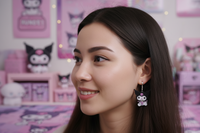 Cartoon rabbit drop earring worn on model's ear, close-up side profile