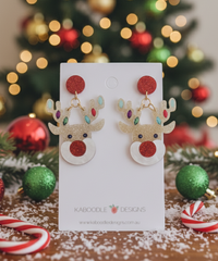 Pair of glitter acrylic Rudolf reindeer drop earrings with red nose on Kaboodle card