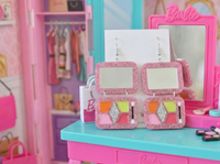 Pair of pink glitter palette earrings on card, front view showing rainbow eyeshadow colours