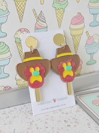 Acrylic Bubble O Bill ice cream drop earrings on a Kaboodle Designs card, ice cream print background