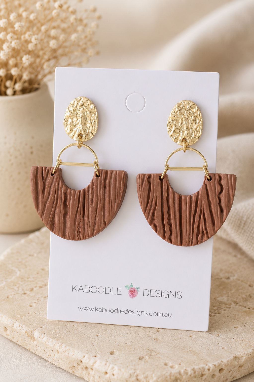 Cinnamon clay fan drop earrings with hammered gold studs on Kaboodle Designs card