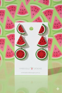 Acrylic watermelon drop earrings on Kaboodle Designs card, three-tier slice design in red and green