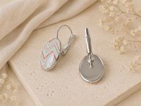 Side view of chevron clip earring showing lever-back mechanism and plain silver reverse