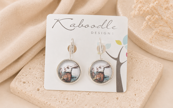 White Rabbit round leverback earrings on Kaboodle Designs backing card, close up