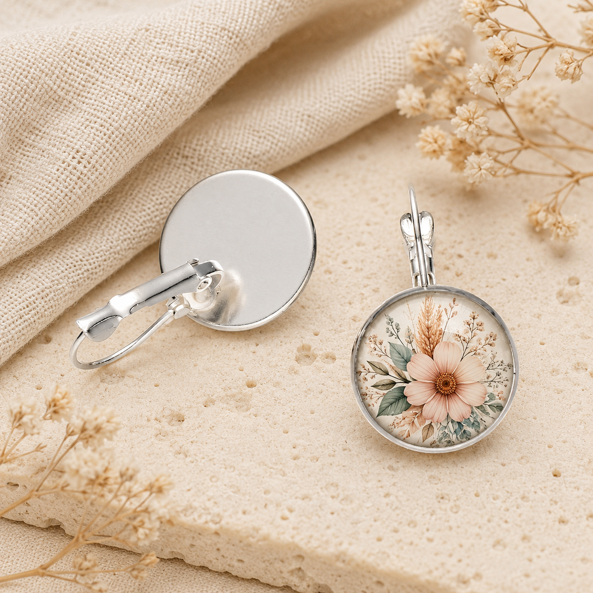 Silver-plated leverback earring back and clasp shown beside floral-design earring for detail