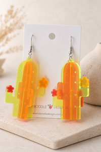 Pair of layered cactus earrings displayed on Kaboodle Designs backing card