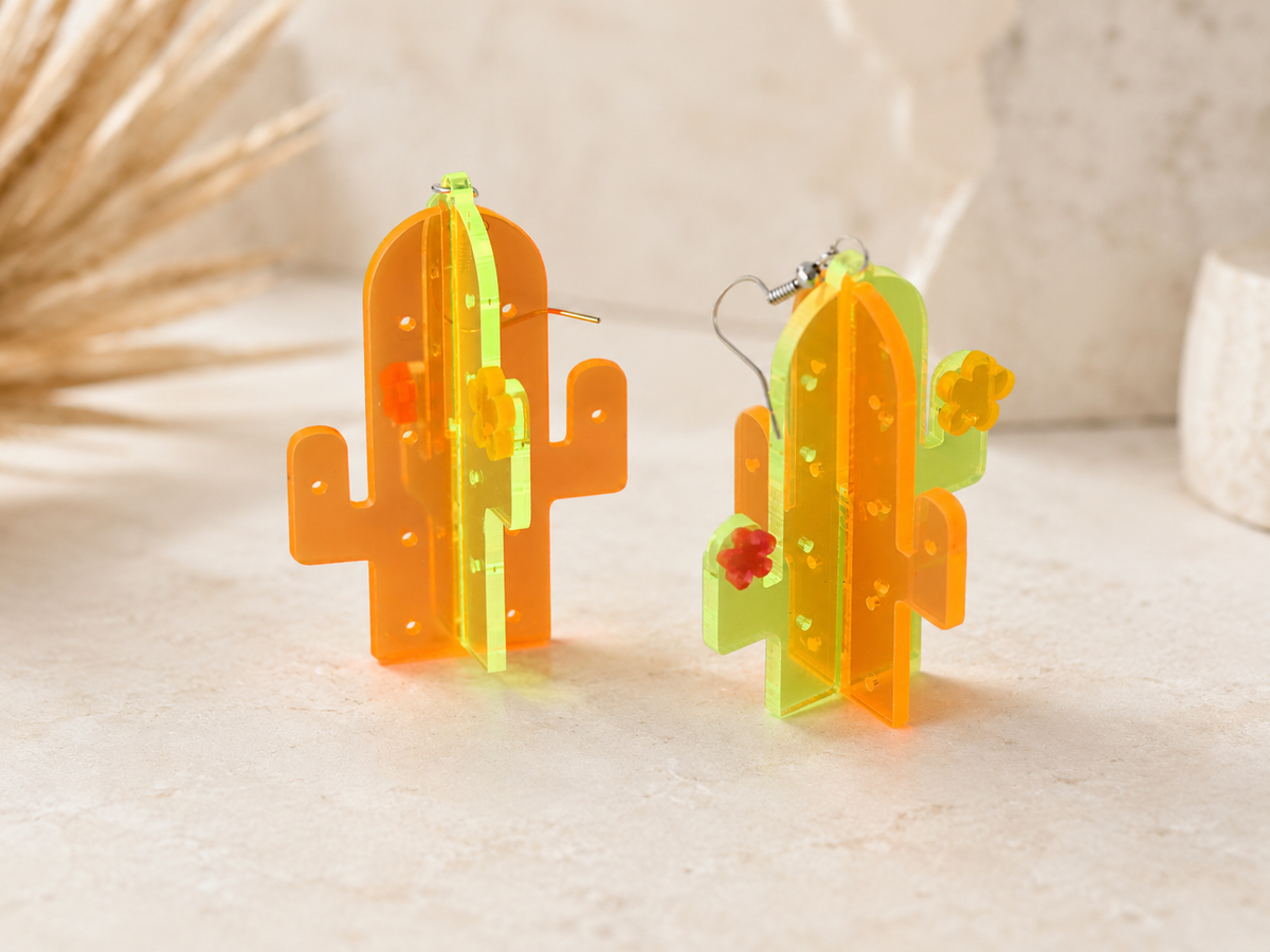 Side view of 3D cactus earrings showing layered acrylic construction and stainless steel hooks