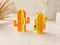 Side view of 3D cactus earrings showing layered acrylic construction and stainless steel hooks