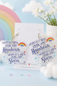 Clear acrylic drop earrings printed with rainbow, clouds and stars quote, on Kaboodle card