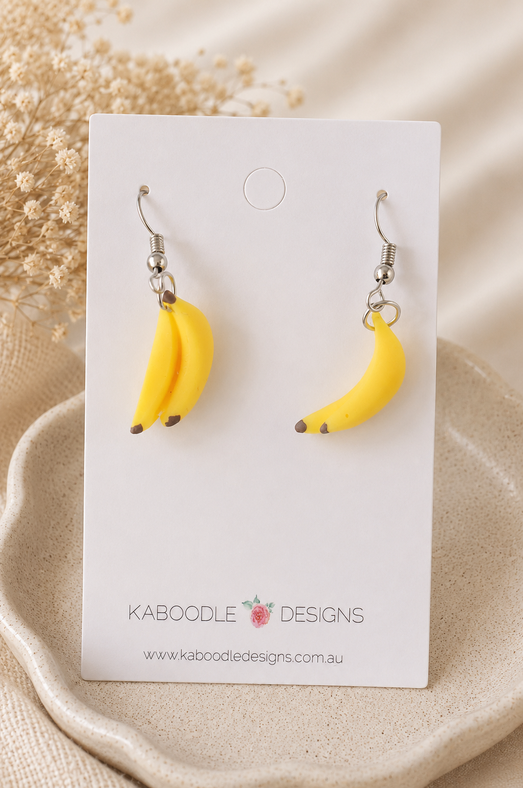 Banana bunch drop earrings displayed on a Kaboodle Designs earring card
