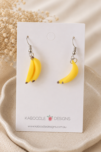 Banana bunch drop earrings displayed on a Kaboodle Designs earring card