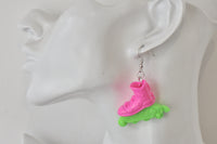Single rollerblade earring shown worn on a model's ear