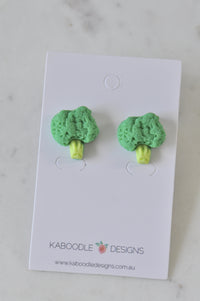 Two green broccoli stud earrings with textured florets on a Kaboodle Designs card