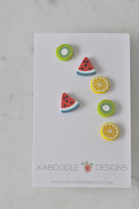 Set of six fruit stud earrings on card: kiwi, watermelon and lemon slice designs in silicone