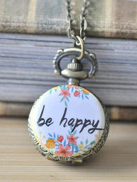 Antique bronze pocket watch necklace with floral be happy wreath design on white face