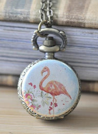 Flamingo pocket watch necklace pendant with floral artwork and antique brass case