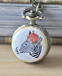 Bronze pocket watch necklace with zebra and rose artwork on the cover