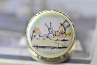 Mad Hatter tea party pocket watch necklace pendant shown close up with worn size reference
