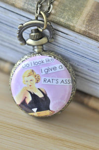 Retro pin up girl pocket watch necklace with cheeky quote on pink background
