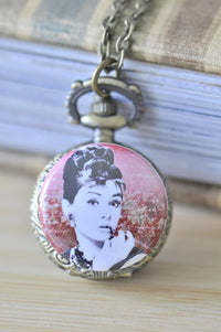 Bronze pocket watch necklace with Audrey Hepburn portrait on rose floral background